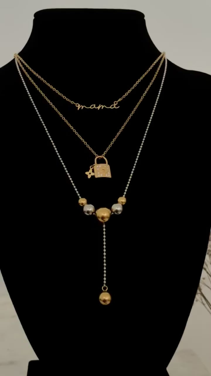 collar de bolas doradas y plateada